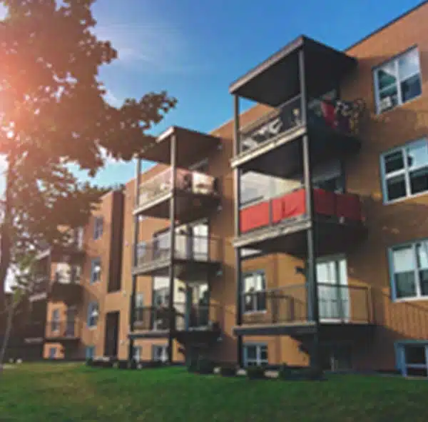 a building with a lawn and trees