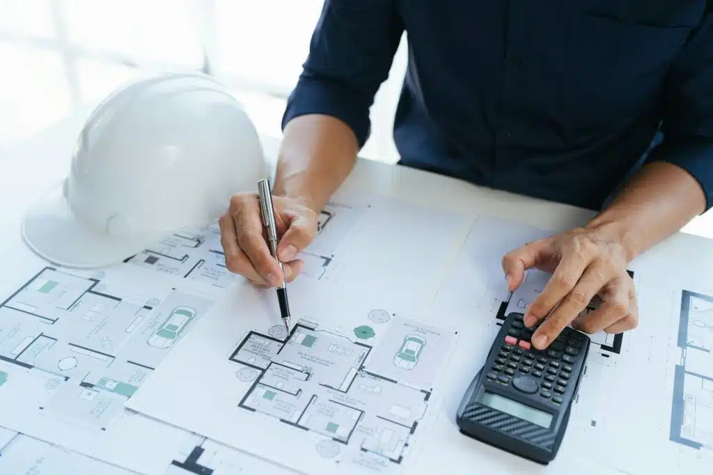 Close-up, architects team are brainstorming, designing and drawing the structure of the building.