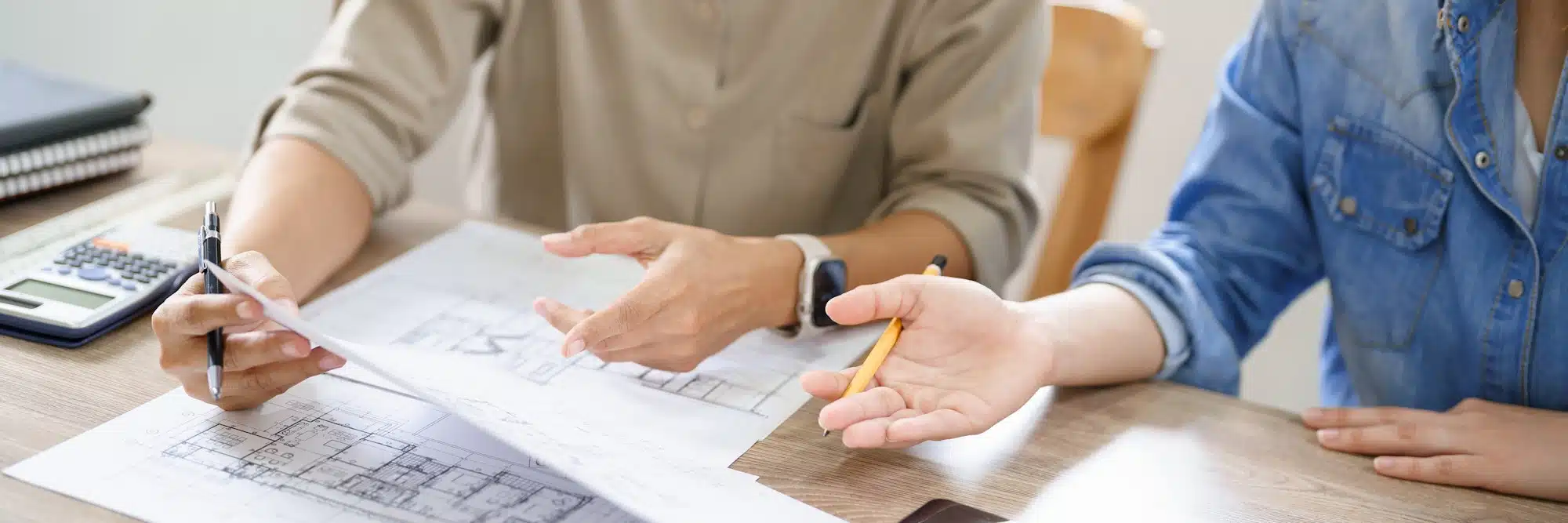Concept of engineering consulting, Two female engineers discussing about blueprint of construction